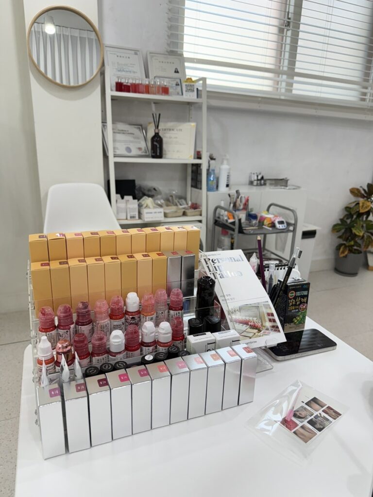 Brow and lash products lined up on the consultation desk