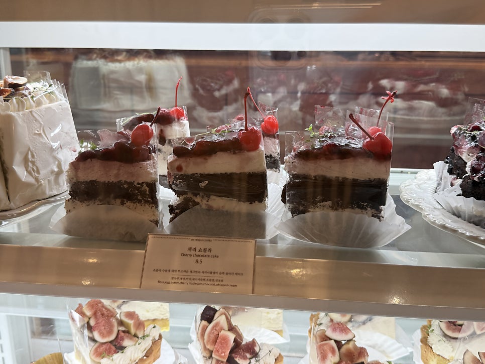 Cherry chocolate cake in the showcase