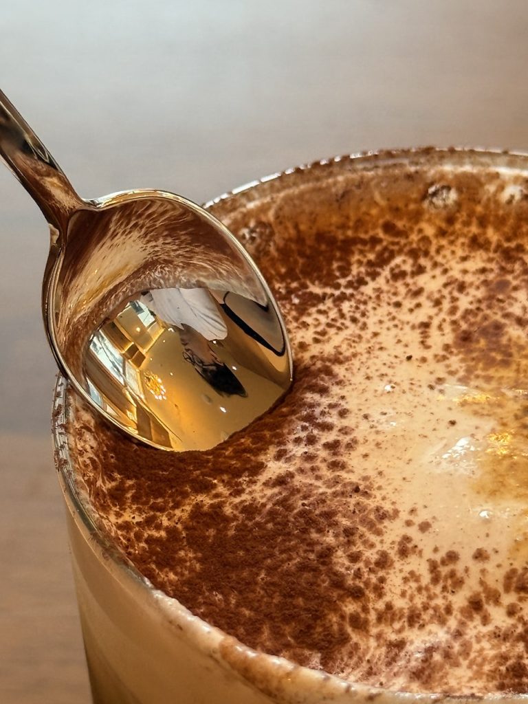 Signature cream coffee dusted with cocoa