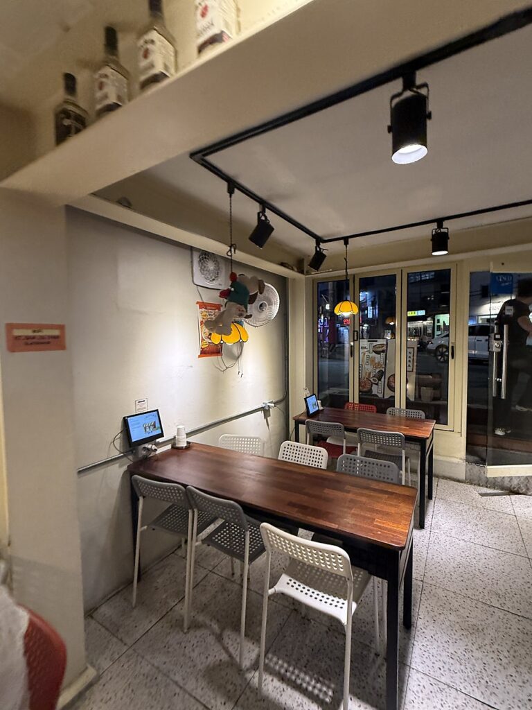 Window-side tables inside the snack bar