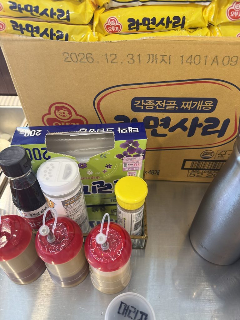 Boxes of free ramyeon noodles at the self-service bar