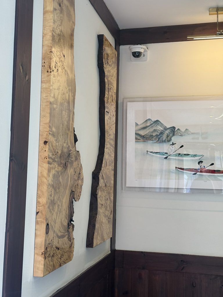 Wooden hanok-style interior with landscape paintings