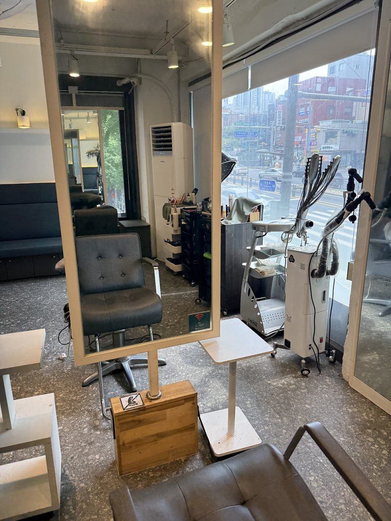 Bright salon interior with large windows
