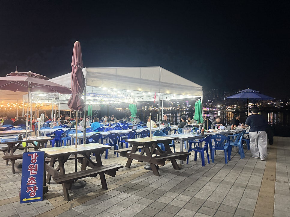 Tent tables lit up at night