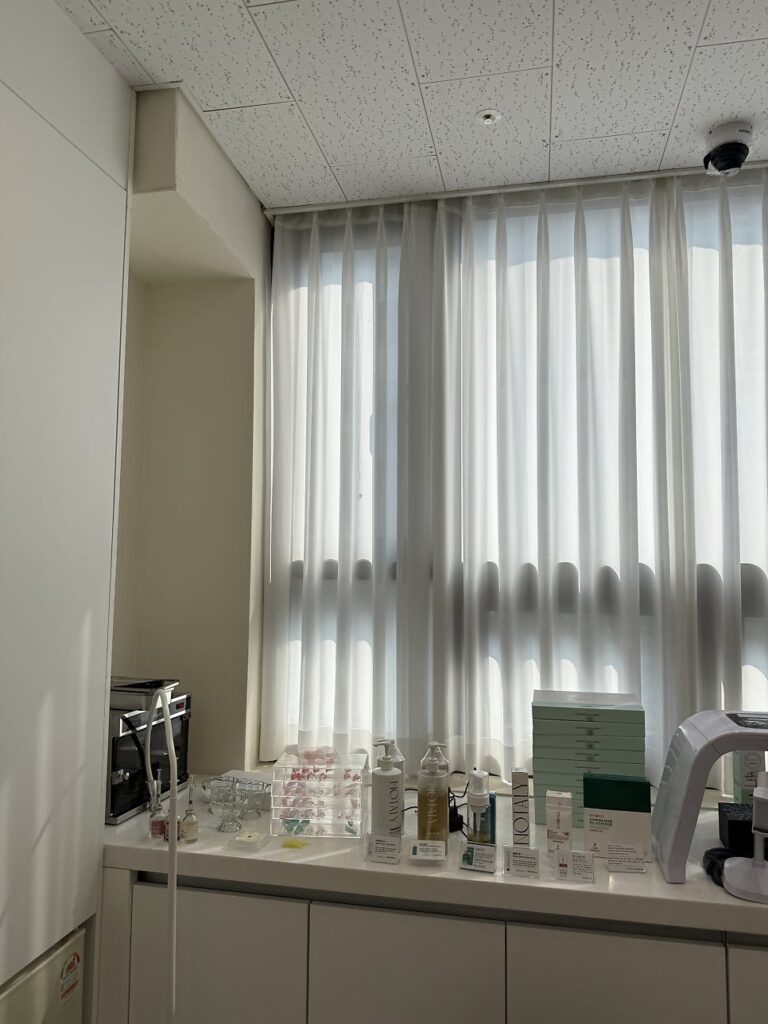 Scalp care products and devices lined up by the window