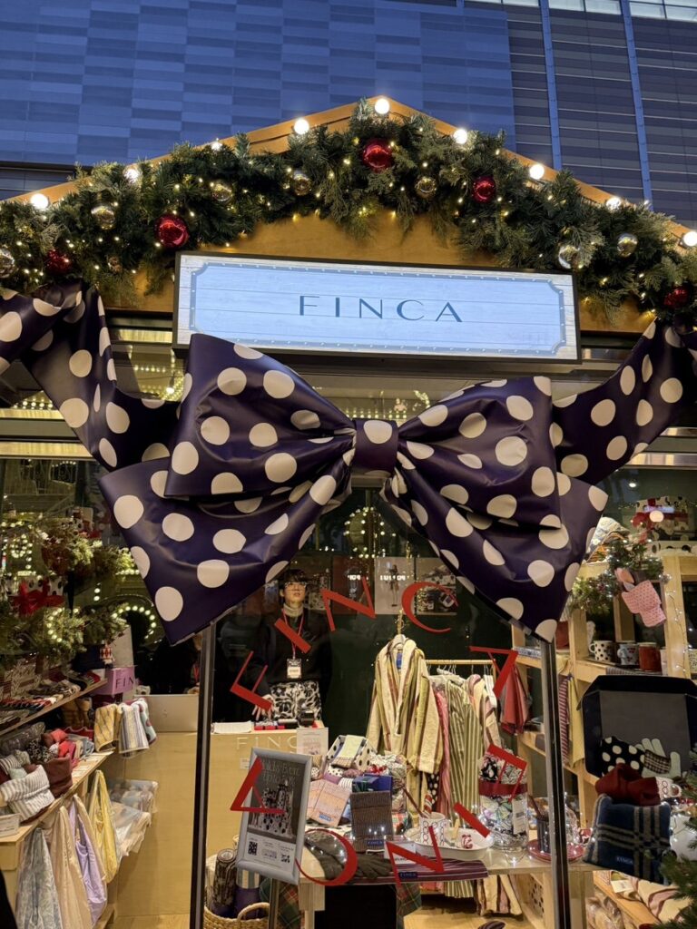 Festive gift shop booth with a giant polka-dot bow