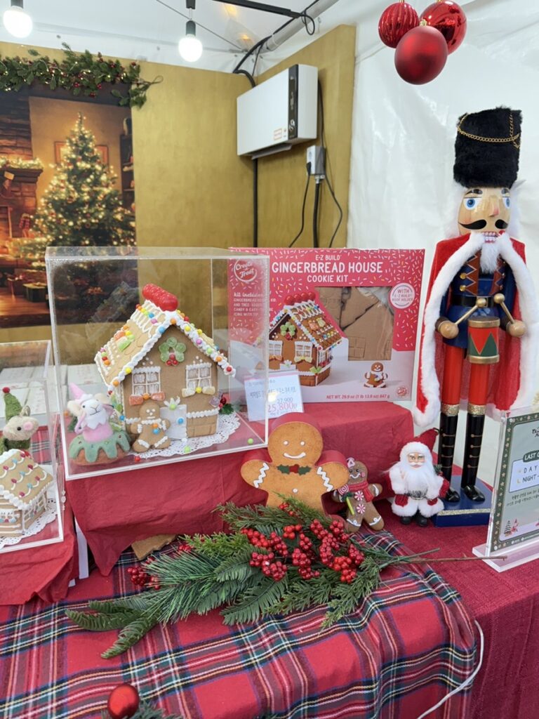 Gingerbread houses and a nutcracker at a holiday booth