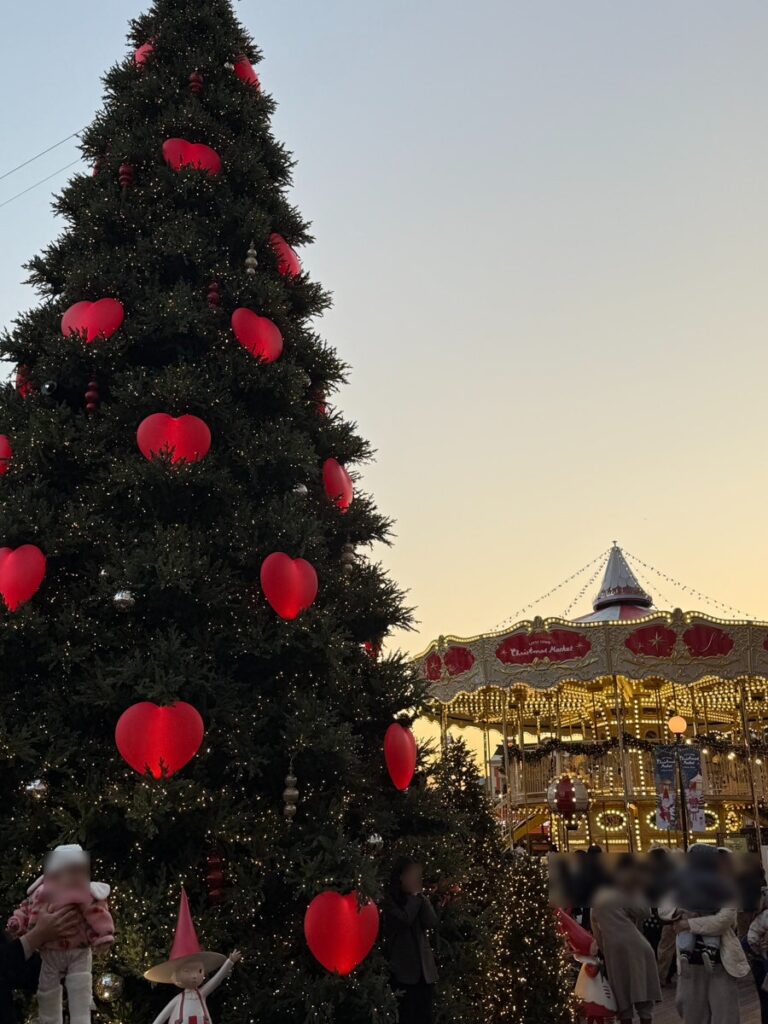 Heart-covered tree and the double-decker carousel at sunset