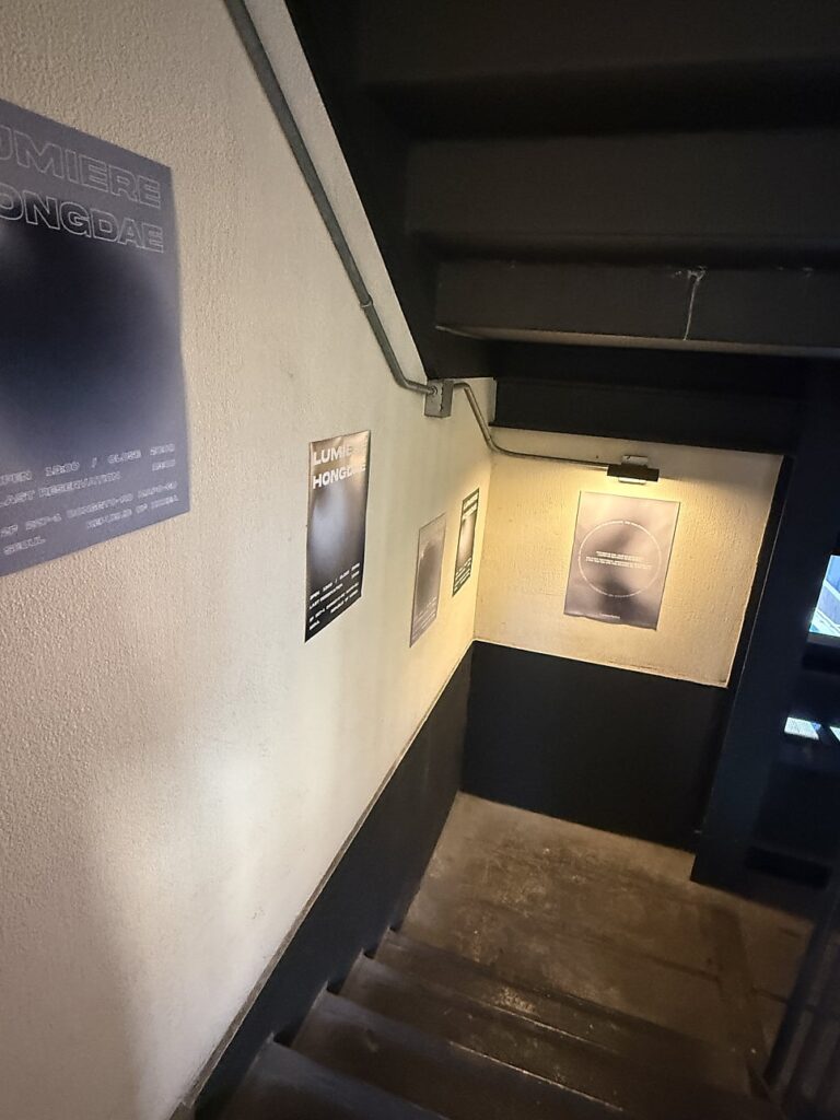 Stairway with posters leading up to the studio
