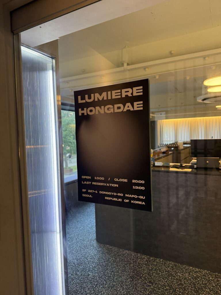 Entrance poster with opening hours and last reservation time