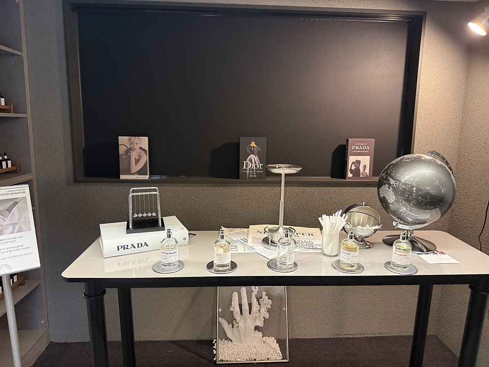 Tester table with photo books and a globe