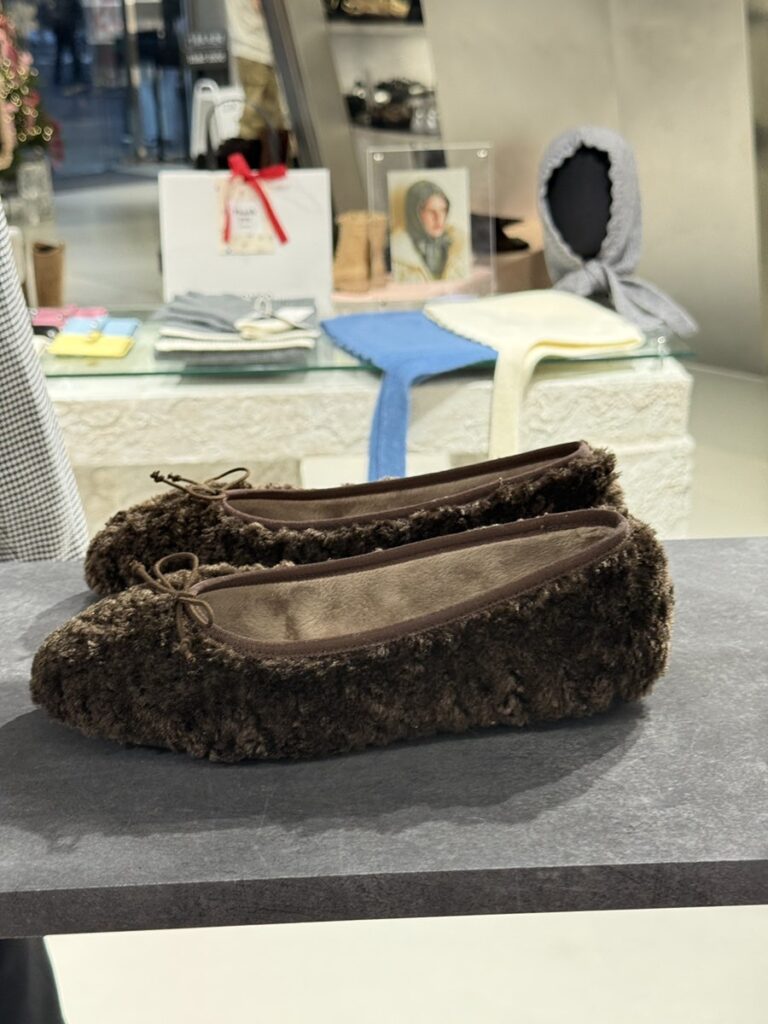 Fluffy brown ballet flats with a bow