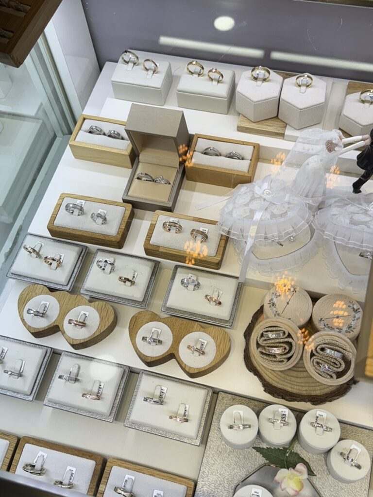 Wedding rings displayed in heart-shaped and round trays