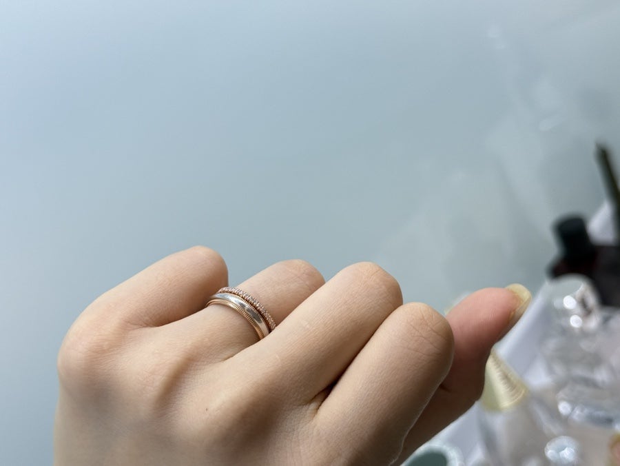Trying on a slim gold band
