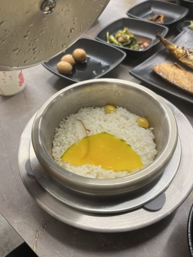 Fresh pot rice topped with a slice of sweet pumpkin