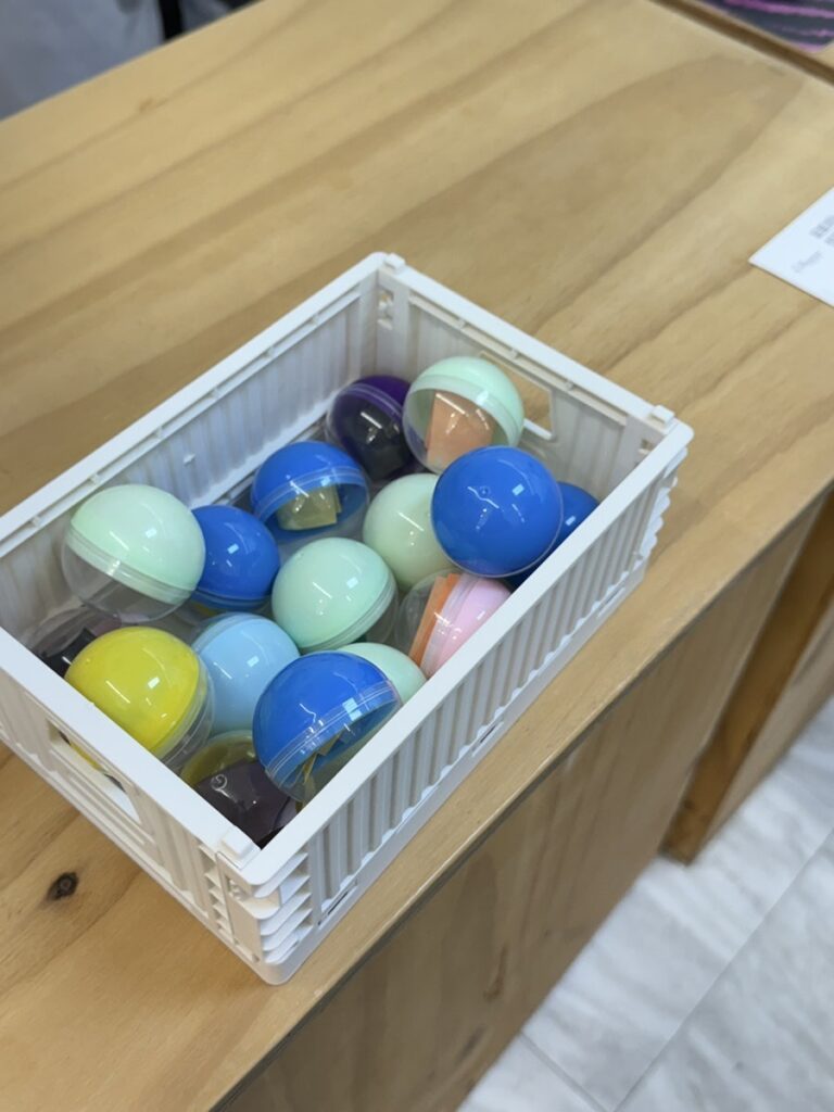 Box of colorful capsule balls at the counter
