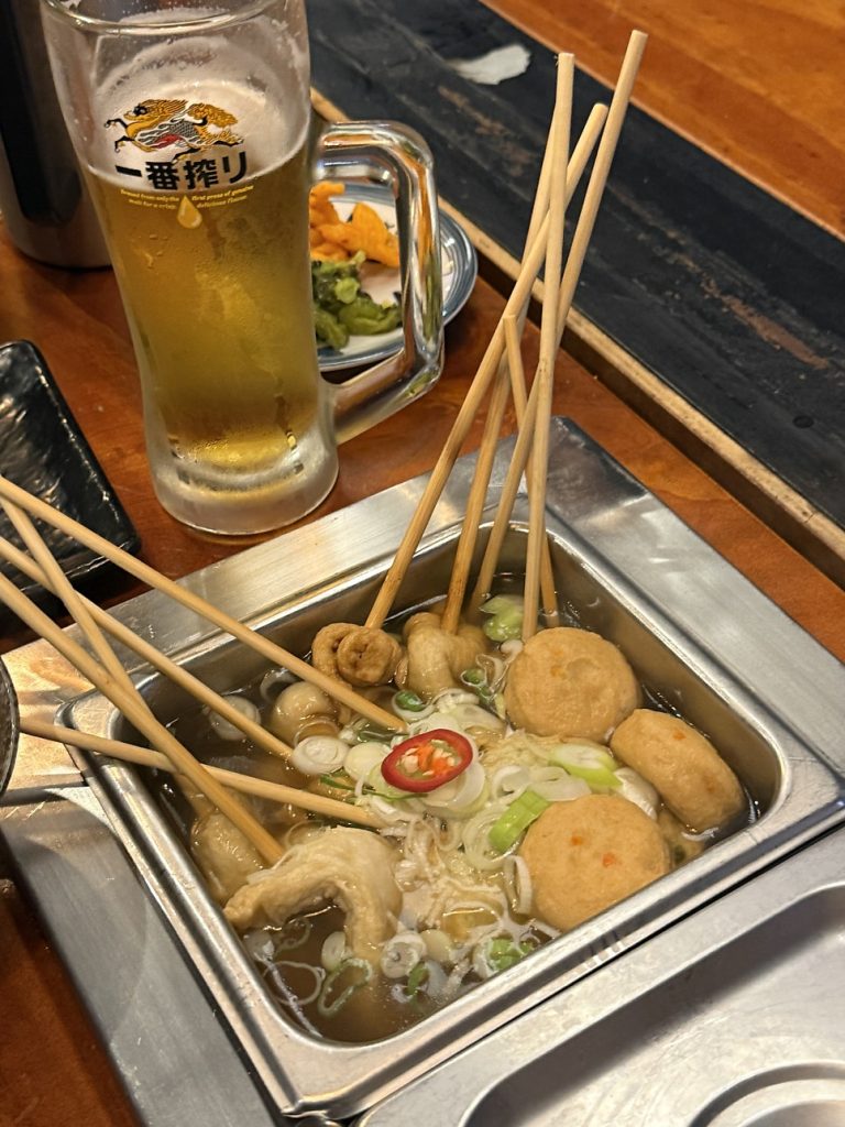 Pot of Busan mixed oden on skewers