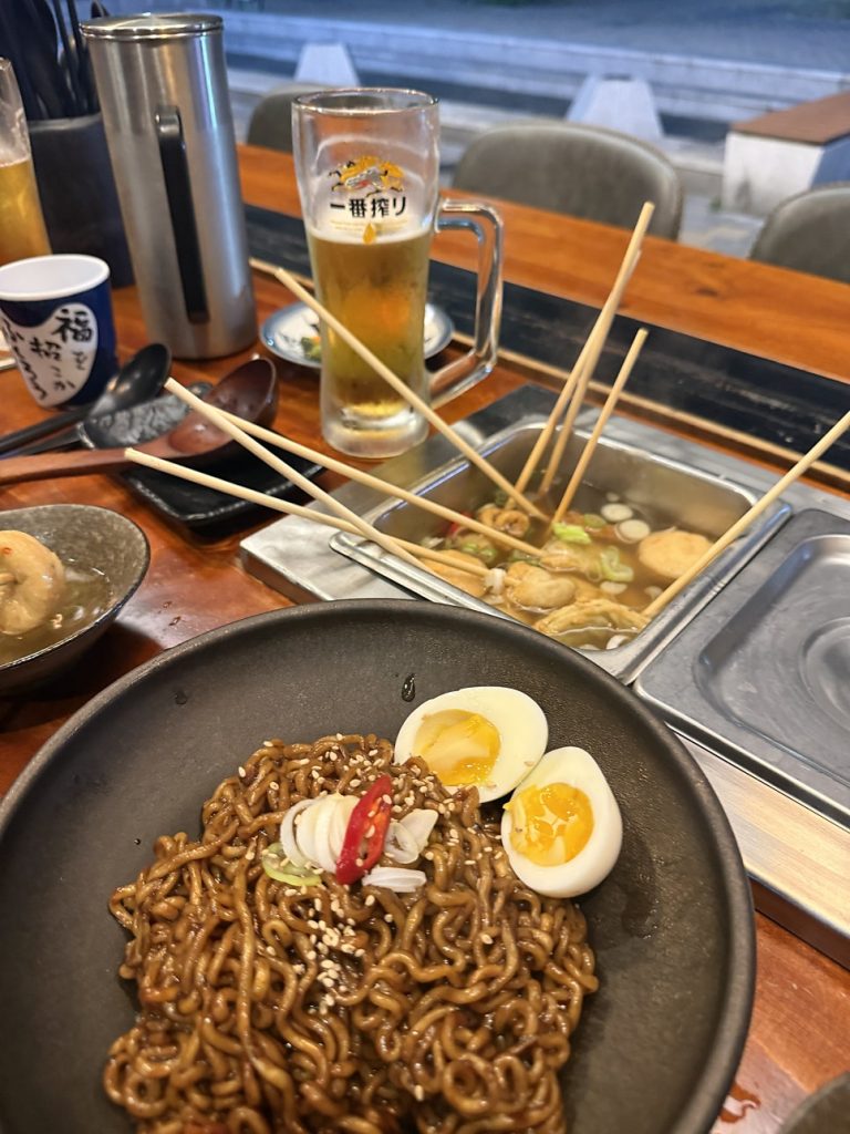 Truffle jjapaghetti topped with soft-boiled egg