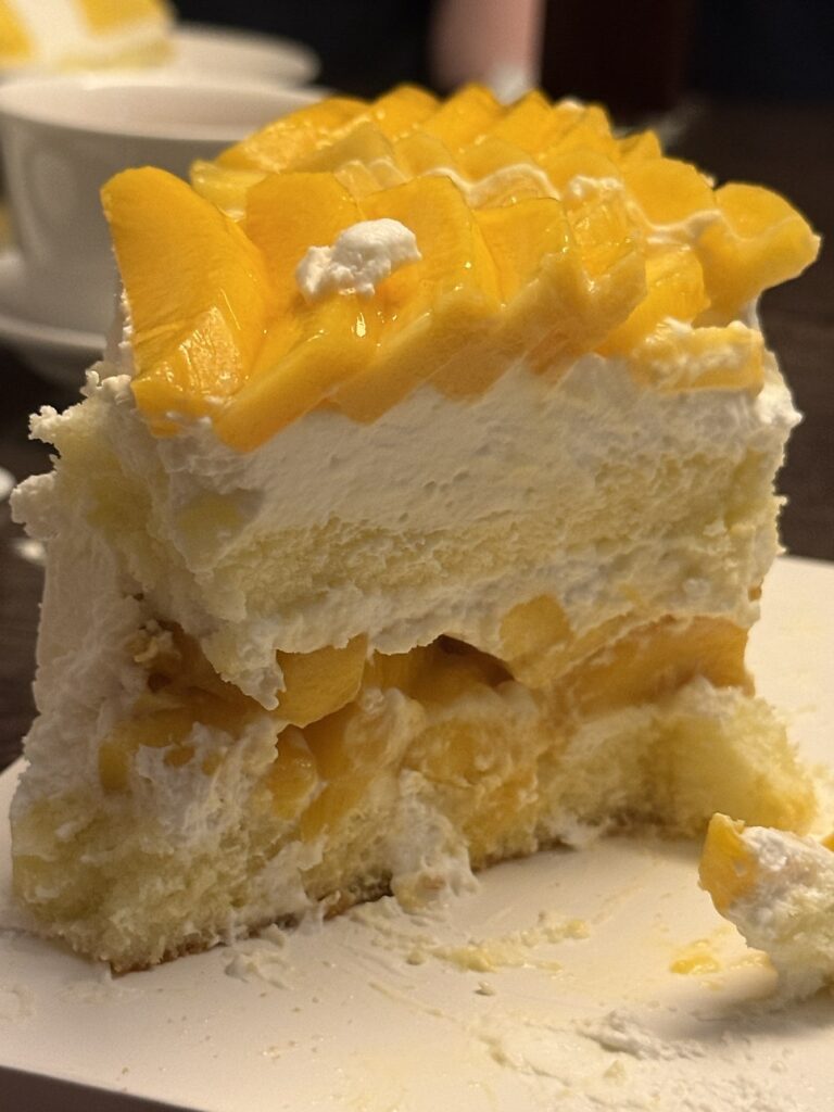 Close-up of mango cake layers with soft sponge
