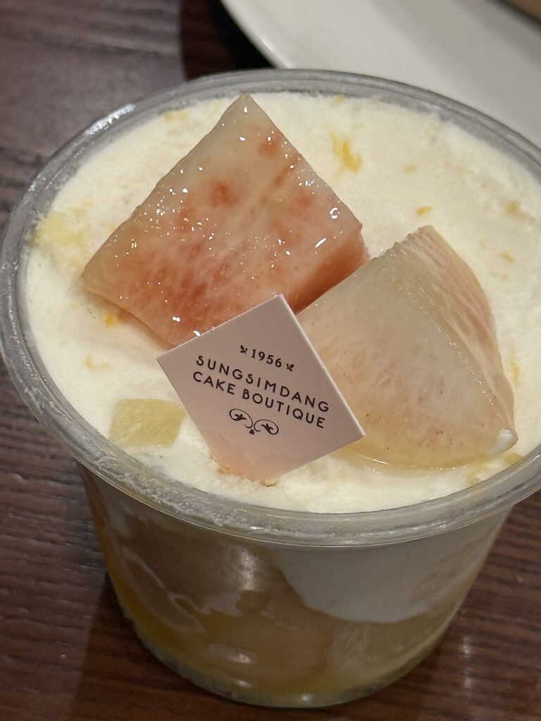 Yogurt Peach cup topped with peach slices