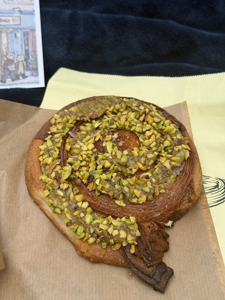 Pistachio kouign-amann covered in pistachios