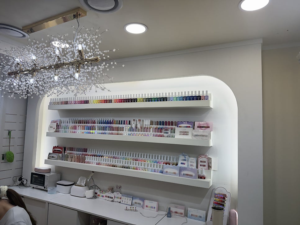 Nail shop with a wall of colorful polish bottles