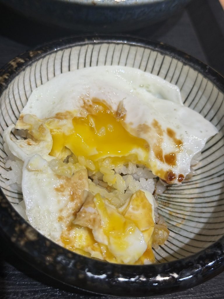 Tsuyu egg rice with a runny yolk